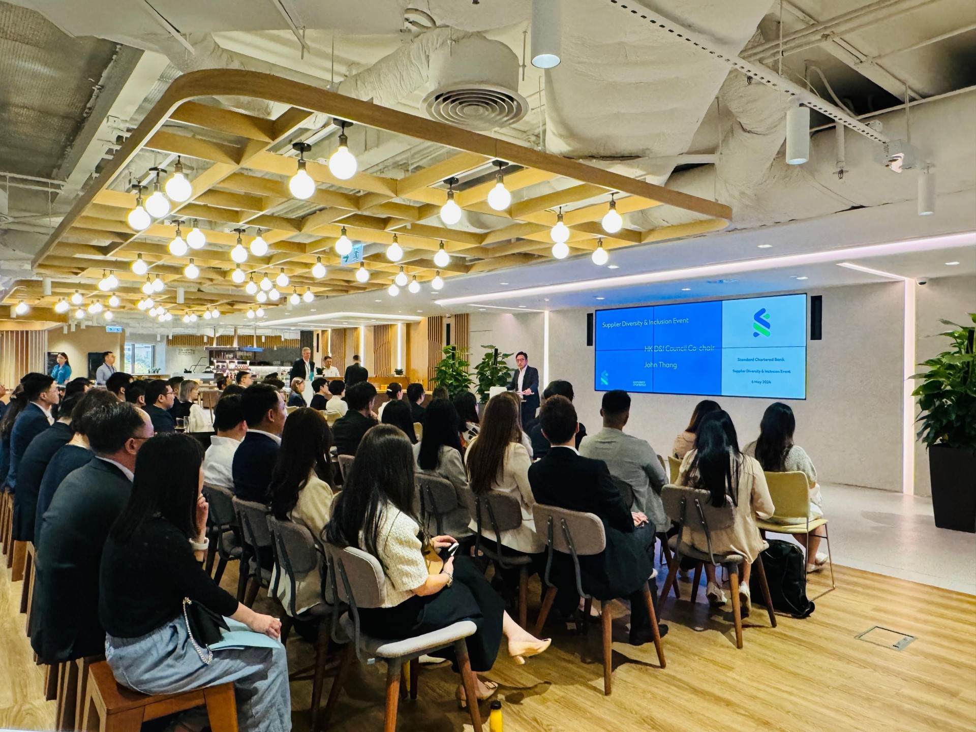 Suppliers listen to a presentation at the event.