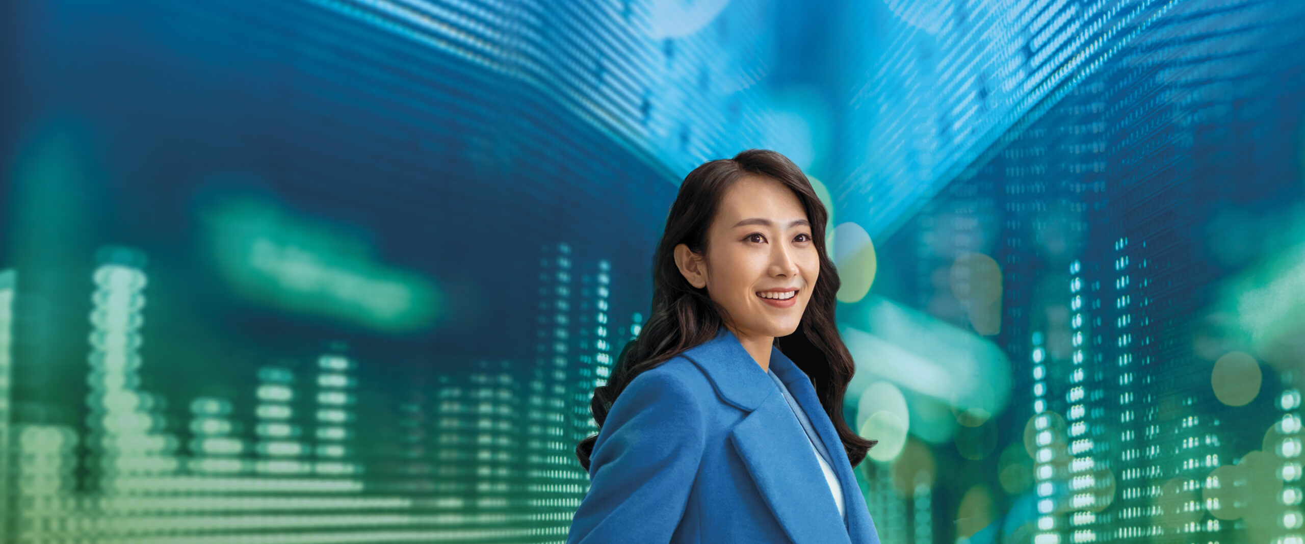 A young woman uses an interactive screen.