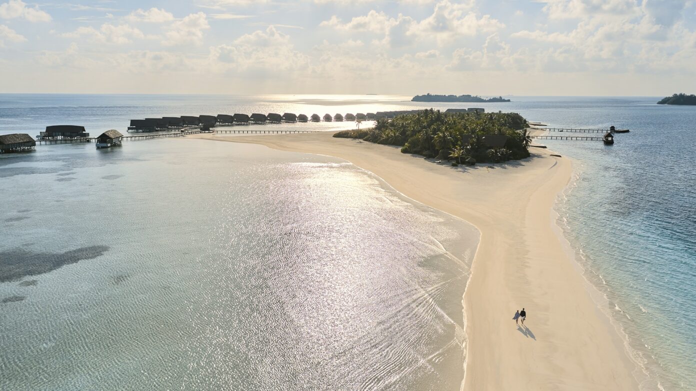 aerial sandbank couple walking sunrise