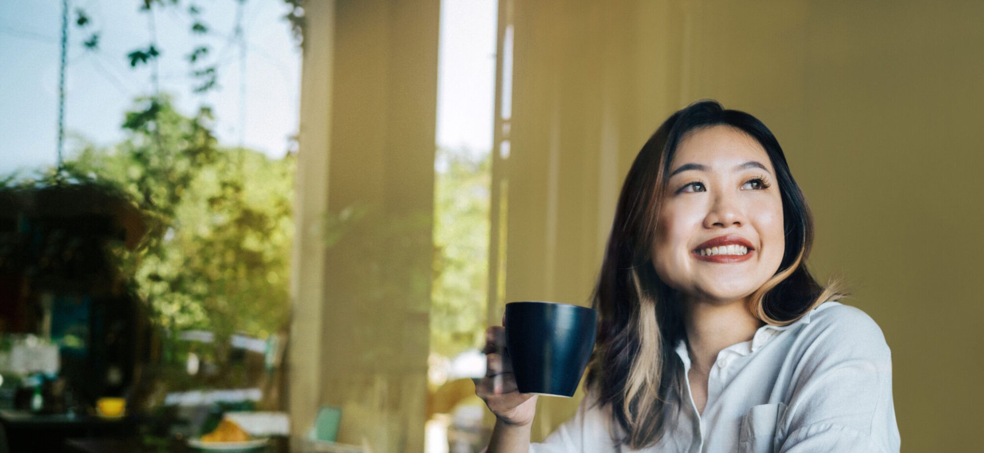 A girl holding a mug
