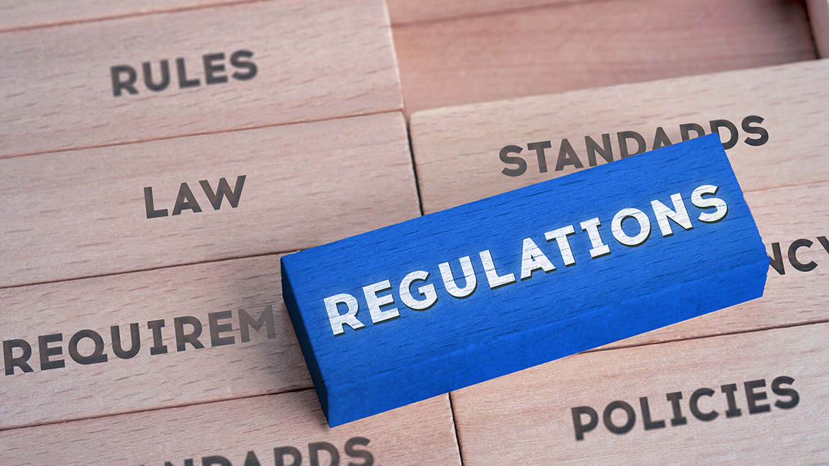 Regulations Concept with Wooden Blocks in Red Color