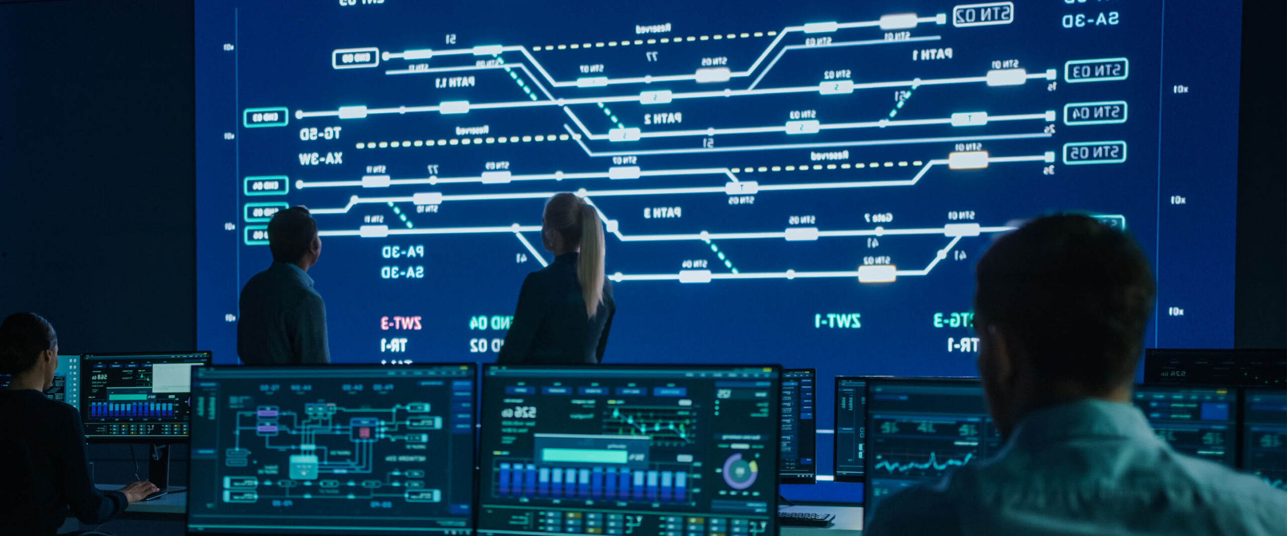 Computer engineers work on a public transport system.