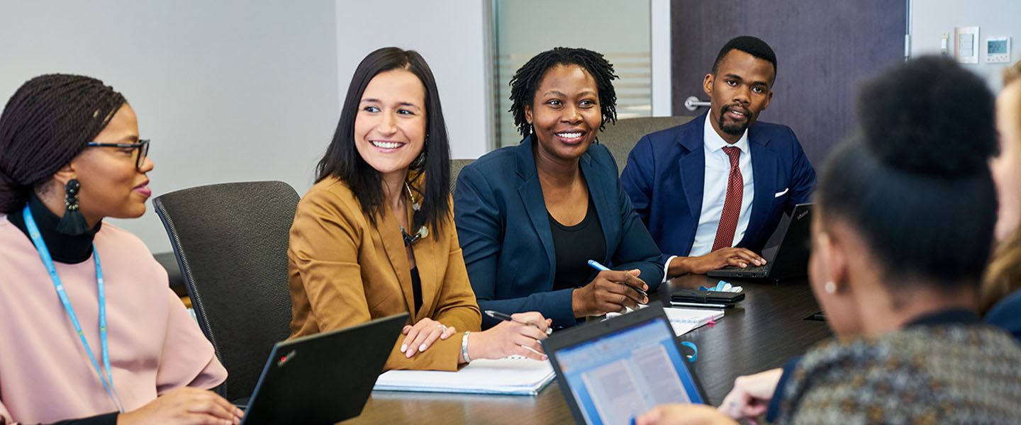 A student taking notes while trying to remember the things she has learned for her exams