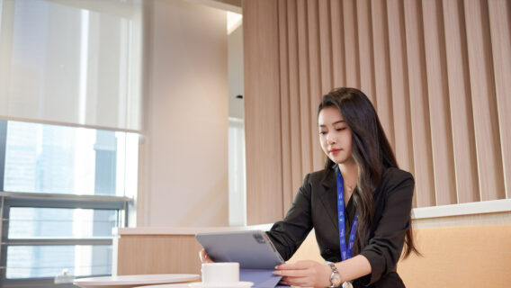 Women working in the office looking at an ipad