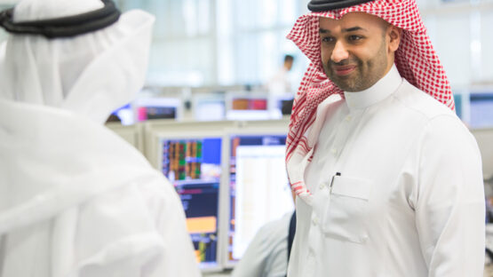 Two men discussing Islamic banking for companies