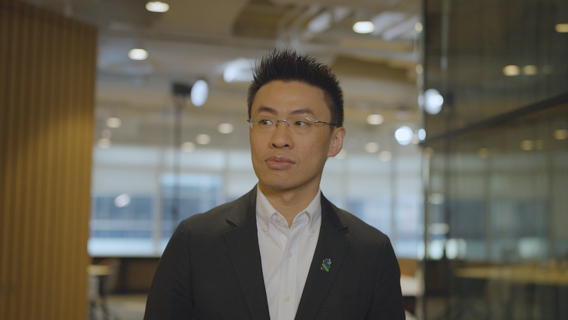 A man with glasses in a suit