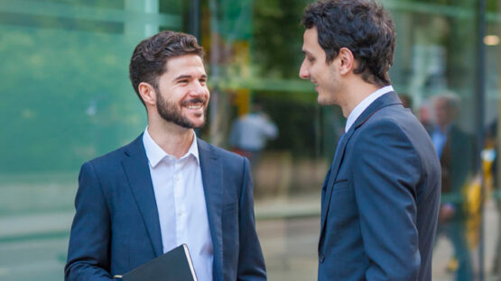 2 men talking outside