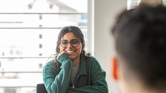 women smiling at a table
