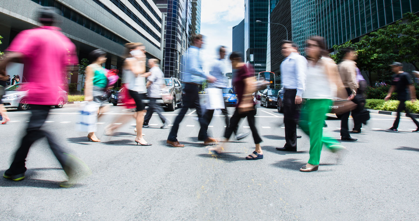 Busy people crossing street