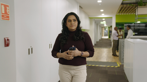 Lady walking through a workspace